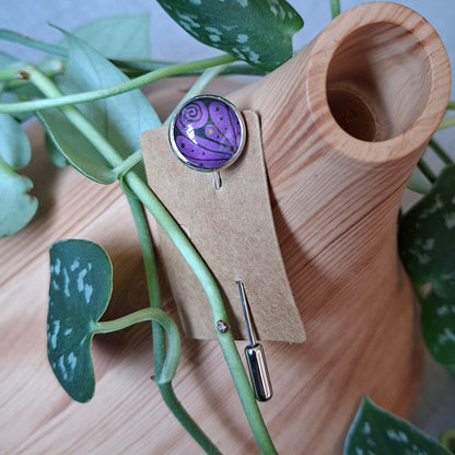 Purple frond design on a stick pin brooch